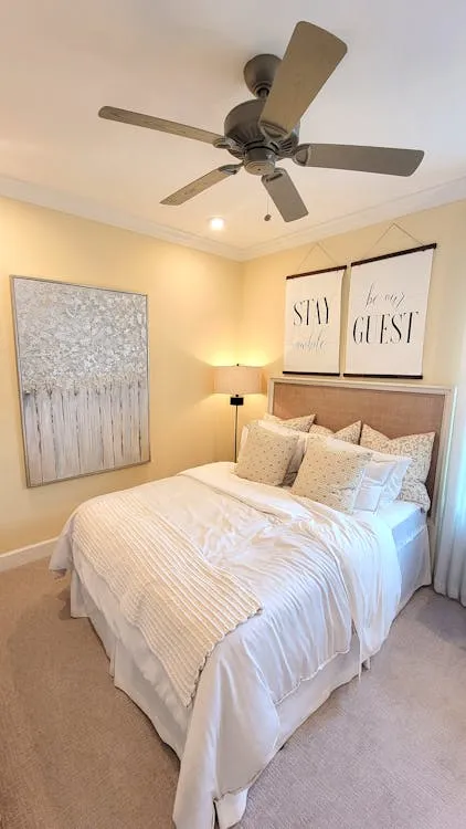 Beautifully made rental bed with fresh linens